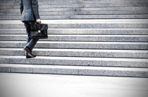 A man walking up some stairs