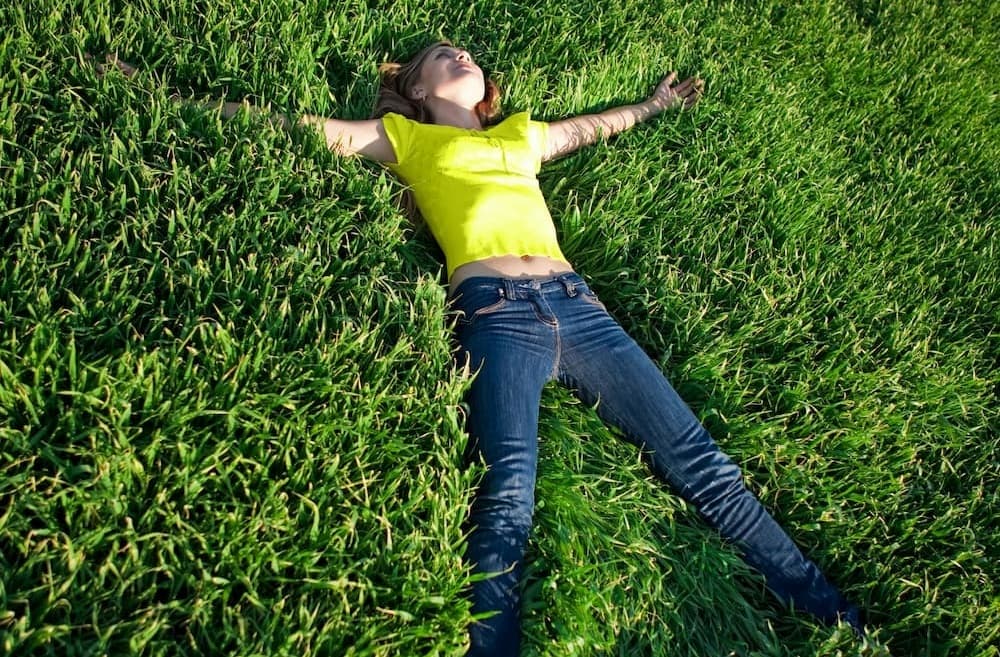 A woman lying in grass