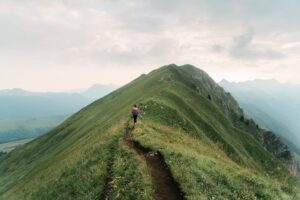 Someone walking on a mountain ridge